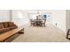 Expansive carpeted basement with dining and living areas at 6890 Autumn Hills Dr, Cumming, GA 30028