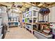 Spacious basement storage with shelving units for organization and storing household items, boxes, and seasonal decor at 6890 Autumn Hills Dr, Cumming, GA 30028
