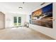 Basement area with French doors and a military plane wall art at 6890 Autumn Hills Dr, Cumming, GA 30028