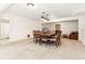 Finished basement area with carpet, dining table, and bathroom view at 6890 Autumn Hills Dr, Cumming, GA 30028