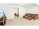 Finished basement with sofa, tv, and view of bedroom area at 6890 Autumn Hills Dr, Cumming, GA 30028
