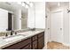 Bathroom with double sinks, granite countertops, and updated fixtures at 6890 Autumn Hills Dr, Cumming, GA 30028