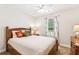 Cozy bedroom with wood furniture and bright natural light at 6890 Autumn Hills Dr, Cumming, GA 30028