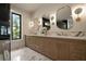 Bathroom with double vanity, marble countertops, and stylish lighting at 130 Nova Ln, Roswell, GA 30075