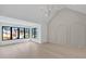 Spacious bedroom with large windows, a high ceiling, and decorative molding at 130 Nova Ln, Roswell, GA 30075