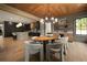 Open floor plan showcasing the dining area with views to the kitchen and bar area at 130 Nova Ln, Roswell, GA 30075