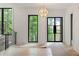 Bright foyer with large windows providing natural light and views of the surrounding greenery at 130 Nova Ln, Roswell, GA 30075