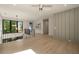 Open hallway with hardwood floors, modern lighting, and black metal railing at 130 Nova Ln, Roswell, GA 30075