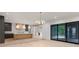 Open concept kitchen with stainless appliances, a marble island, and access to the living room at 130 Nova Ln, Roswell, GA 30075