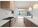Bright kitchen showcasing marble countertops, custom cabinets, and stainless steel appliances at 130 Nova Ln, Roswell, GA 30075