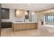Modern kitchen with custom wood cabinets, stainless steel appliances, and a large marble countertop island at 130 Nova Ln, Roswell, GA 30075