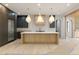 Modern kitchen with custom wood cabinets, stainless steel appliances, and a large marble countertop island at 130 Nova Ln, Roswell, GA 30075