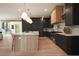 Elegant kitchen with an island, stainless steel appliances, custom cabinets, and marble countertops at 130 Nova Ln, Roswell, GA 30075