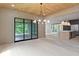 Kitchen and dining with wood ceiling, stainless appliances, and an island at 130 Nova Ln, Roswell, GA 30075