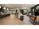 Open concept living room featuring hardwood floors, modern furnishings, and access to the outdoors at 130 Nova Ln, Roswell, GA 30075