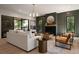Comfortable living room with a fireplace, modern decor, and sliding glass doors to the backyard at 130 Nova Ln, Roswell, GA 30075