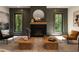 Elegant living room with fireplace, modern decor, and comfortable seating area with coffee tables at 130 Nova Ln, Roswell, GA 30075
