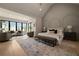 Spacious main bedroom with sitting area, vaulted ceiling, and large windows at 130 Nova Ln, Roswell, GA 30075