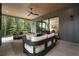 Inviting covered patio with comfortable seating, a ceiling fan, and views of the lush backyard at 130 Nova Ln, Roswell, GA 30075
