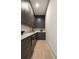 Walk-in pantry with custom cabinetry, countertops, and ample storage space at 130 Nova Ln, Roswell, GA 30075