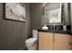Powder room with modern vanity, a stylish sink, and elegant decor at 130 Nova Ln, Roswell, GA 30075