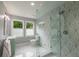 Bathroom featuring modern fixtures, stylish tile, large glassed shower, and bright natural light at 417 S Candler St, Decatur, GA 30030