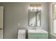 Bathroom with a bright green vanity, modern fixtures, and stylish tile at 417 S Candler St, Decatur, GA 30030