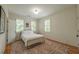Simple bedroom featuring hardwood floors, natural light, bright walls, and custom lighting at 417 S Candler St, Decatur, GA 30030