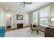 Bright bedroom featuring a ceiling fan, a large rug, and desk nook overlooking the yard at 417 S Candler St, Decatur, GA 30030