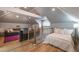 Spacious bonus room with sleeping and seating areas, wood floors, and good light at 417 S Candler St, Decatur, GA 30030
