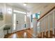 Bright foyer featuring hardwood floors, a staircase, and a view into other rooms at 417 S Candler St, Decatur, GA 30030