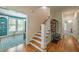 Open hallway leading to living room with hardwood floors, light walls, and bright natural light at 417 S Candler St, Decatur, GA 30030