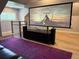 Basement home theater boasts large screen, speaker system, cabinet and colorful carpet at 417 S Candler St, Decatur, GA 30030