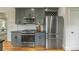 Well-equipped kitchen with stainless steel appliances, gray cabinets, and granite countertops at 417 S Candler St, Decatur, GA 30030