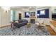 Inviting living room with a cozy fireplace, built-in cabinets, and beautiful blue accent wall at 417 S Candler St, Decatur, GA 30030