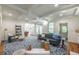 Bright living space featuring coffered ceilings, hardwood floors, and access to an outdoor patio at 417 S Candler St, Decatur, GA 30030