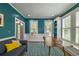 Stylish home office featuring ample natural light, wainscotting and attractive teal walls at 417 S Candler St, Decatur, GA 30030