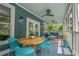 Outdoor porch with a seating area, ceiling fans, and a light blue painted deck at 417 S Candler St, Decatur, GA 30030