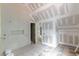 Bathroom featuring tiled walls, and two open doorways, during the construction phase at 4608 Kings Down Rd, Atlanta, GA 30338