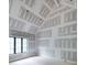 Bedroom with vaulted ceilings and a large window, during the construction phase at 4608 Kings Down Rd, Atlanta, GA 30338
