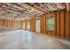 Large unfinished basement with insulated ceiling, windows, and an exterior door provides plenty of potential at 106 Logan Pass Dr, Loganville, GA 30052