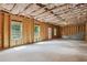 Unfinished basement offers a blank canvas for customization with windows and exterior door for easy access at 106 Logan Pass Dr, Loganville, GA 30052
