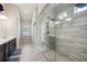 Modern bathroom featuring a glass shower and dual vanity at 106 Logan Pass Dr, Loganville, GA 30052