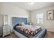 Comfortable bedroom with a patterned bedspread and side tables at 106 Logan Pass Dr, Loganville, GA 30052