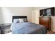 Cozy bedroom featuring a full-size bed, dresser, and wall-mounted television at 106 Logan Pass Dr, Loganville, GA 30052