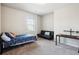Bedroom with carpet, a window, and a bed with an office area at 106 Logan Pass Dr, Loganville, GA 30052