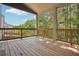 A spacious wooden deck offers an inviting outdoor living space with views of the surrounding lush greenery at 106 Logan Pass Dr, Loganville, GA 30052