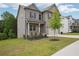 Beautiful home with green lawn, with a gray brick and siding exterior, complemented by a well-maintained landscape at 106 Logan Pass Dr, Loganville, GA 30052