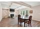 Living room featuring coffered ceilings, fireplace, and natural light at 106 Logan Pass Dr, Loganville, GA 30052