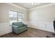 Home office featuring wood floors, fresh paint and detailed trim and a couch at 106 Logan Pass Dr, Loganville, GA 30052